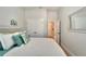 Cozy bedroom with neutral colors, closet, and an open doorway to another room at 527 Manns Harbor Dr, Apollo Beach, FL 33572