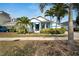 Beautiful single-Gathering home featuring a well-maintained lawn, vibrant landscaping, and a cozy front porch at 527 Manns Harbor Dr, Apollo Beach, FL 33572