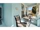 Inviting front porch with comfortable seating, perfect for enjoying the neighborhood views at 527 Manns Harbor Dr, Apollo Beach, FL 33572
