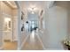 Bright hallway with decorative niches, tile flooring and plenty of natural light at 527 Manns Harbor Dr, Apollo Beach, FL 33572