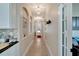 Hallway with decorative archways and views of the front door at 527 Manns Harbor Dr, Apollo Beach, FL 33572