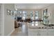 Spacious living room with tile floors, large windows, and open floor plan at 527 Manns Harbor Dr, Apollo Beach, FL 33572