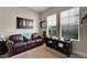 Comfortable office featuring natural light, leather sofa, and a decorative display at 527 Manns Harbor Dr, Apollo Beach, FL 33572