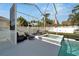 Relaxing pool area with lounge chairs, complemented by a spa, and green landscaping at 527 Manns Harbor Dr, Apollo Beach, FL 33572