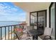 Outdoor seating on a balcony overlooking beach and water views offers a relaxing space for enjoying the coastal scenery at 6265 Sun Blvd # 1201, St Petersburg, FL 33715