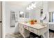 Bathroom features an extended vanity and mirrors, complemented by sleek flooring for a stylish and practical space at 6265 Sun Blvd # 1201, St Petersburg, FL 33715