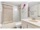 This well-lit bathroom features a shower with sliding glass doors and a modern vanity at 6265 Sun Blvd # 1201, St Petersburg, FL 33715