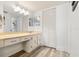This bathroom features a large vanity, ample lighting, and a closet for convenient storage at 6265 Sun Blvd # 1201, St Petersburg, FL 33715