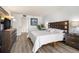 The primary bedroom features modern flooring and ample space for comfort and style at 6265 Sun Blvd # 1201, St Petersburg, FL 33715
