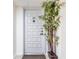 Stylish unit 1201 front door with unique design details and a welcoming touch of greenery at 6265 Sun Blvd # 1201, St Petersburg, FL 33715