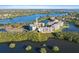 Scenic aerial view of waterfront condos surrounded by lush greenery and sparkling blue water at 6495 Shoreline Dr # 8106, St Petersburg, FL 33708