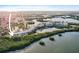 Scenic aerial view showcases a residential complex surrounded by lush greenery and calm waters at 6495 Shoreline Dr # 8106, St Petersburg, FL 33708