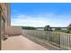 Spacious balcony featuring serene lake views, tropical greenery, and clear blue skies at 6495 Shoreline Dr # 8106, St Petersburg, FL 33708