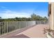 Expansive balcony showcasing lush greenery and mature trees, creating a private outdoor space at 6495 Shoreline Dr # 8106, St Petersburg, FL 33708