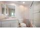 Bathroom featuring vanity with solid surface countertop and tub with glass doors and shower at 6495 Shoreline Dr # 8106, St Petersburg, FL 33708