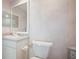 Bathroom featuring vanity with solid surface countertop and a toilet at 6495 Shoreline Dr # 8106, St Petersburg, FL 33708