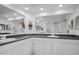 Bright bathroom features double sinks with solid surface countertops and ample cabinet space at 6495 Shoreline Dr # 8106, St Petersburg, FL 33708