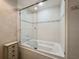 Bright bathroom featuring a shower and bath combination and decorative tile accents at 6495 Shoreline Dr # 8106, St Petersburg, FL 33708