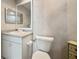 Bathroom featuring vanity with solid surface countertop and a toilet at 6495 Shoreline Dr # 8106, St Petersburg, FL 33708
