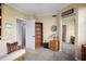 Bedroom featuring light yellow walls, trim detail, a bookcase, and closet with mirror doors at 6495 Shoreline Dr # 8106, St Petersburg, FL 33708
