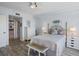 Comfortable bedroom with light walls and wood-look flooring and ensuite bath at 6495 Shoreline Dr # 8106, St Petersburg, FL 33708