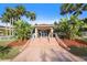 Inviting clubhouse entrance with beautiful landscaping, perfect for community gatherings and social events at 6495 Shoreline Dr # 8106, St Petersburg, FL 33708