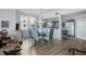 Open-concept dining area boasts contemporary furnishings with seamless flow into the kitchen at 6495 Shoreline Dr # 8106, St Petersburg, FL 33708
