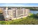 This condo building overlooks lush landscaping and a serene lake at 6495 Shoreline Dr # 8106, St Petersburg, FL 33708