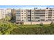 Exterior view of the condominium featuring covered parking and well-manicured lawns in a waterfront community at 6495 Shoreline Dr # 8106, St Petersburg, FL 33708