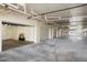 Long row of garages in the parking area with smooth concrete floors and white walls at 6495 Shoreline Dr # 8106, St Petersburg, FL 33708