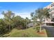 Well-maintained condo grounds featuring mature trees, walking path and views of the community's lake and lush landscaping at 6495 Shoreline Dr # 8106, St Petersburg, FL 33708