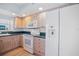 Spacious kitchen with wood cabinets, modern appliances, and a bright interior at 6495 Shoreline Dr # 8106, St Petersburg, FL 33708