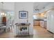 Bright kitchen boasts matching appliances and seamlessly connects to dining and living areas at 6495 Shoreline Dr # 8106, St Petersburg, FL 33708