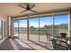 Spacious screened lanai with seating, water views and a ceiling fan at 6495 Shoreline Dr # 8106, St Petersburg, FL 33708