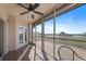 Screened lanai featuring a tile floor, ceiling fan and expansive views of the water at 6495 Shoreline Dr # 8106, St Petersburg, FL 33708