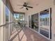 Enclosed lanai with tile flooring, a ceiling fan, and sliding glass doors to the interior at 6495 Shoreline Dr # 8106, St Petersburg, FL 33708
