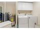 A functional laundry room is equipped with washer, dryer, and a water heater at 6495 Shoreline Dr # 8106, St Petersburg, FL 33708