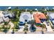 Overhead view of a waterfront home with a pool and boat dock, nestled among lush foliage at 6603 Seabird Way, Apollo Beach, FL 33572