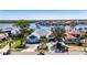 Stunning aerial view of a waterfront property with lush landscaping and a private dock at 6603 Seabird Way, Apollo Beach, FL 33572