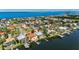 Waterfront property with boat docks, surrounded by lush landscaping and serene water views at 6603 Seabird Way, Apollo Beach, FL 33572