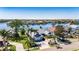 Beautiful aerial view of a waterfront house with manicured lawn and lush landscaping at 6603 Seabird Way, Apollo Beach, FL 33572
