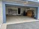 Spacious two-car garage with ample storage and well-lit interior with organized shelves at 6603 Seabird Way, Apollo Beach, FL 33572