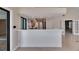 Open-concept kitchen with bar seating, stainless steel appliances, and view to dining area at 6603 Seabird Way, Apollo Beach, FL 33572