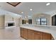 Open floor plan showcases the kitchen and living room with water views and fireplace at 6603 Seabird Way, Apollo Beach, FL 33572
