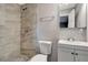 Updated bathroom featuring a tiled shower with modern fixtures and a sleek vanity at 7101 Kingston Dr, Tampa, FL 33619