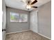 Bright bedroom features a ceiling fan and window bringing in lots of natural light at 7101 Kingston Dr, Tampa, FL 33619