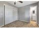 Bedroom with a closet and a bathroom in view, carpeted floor, and gray walls at 7101 Kingston Dr, Tampa, FL 33619