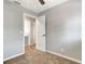Bedroom features a light gray walls, neutral carpet, and door leading to other rooms at 7101 Kingston Dr, Tampa, FL 33619
