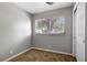 Bedroom featuring a sliding door closet and window bringing in lots of natural light at 7101 Kingston Dr, Tampa, FL 33619