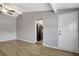 Open-concept living room with vaulted ceilings, ceiling fan, and modern flooring at 7101 Kingston Dr, Tampa, FL 33619